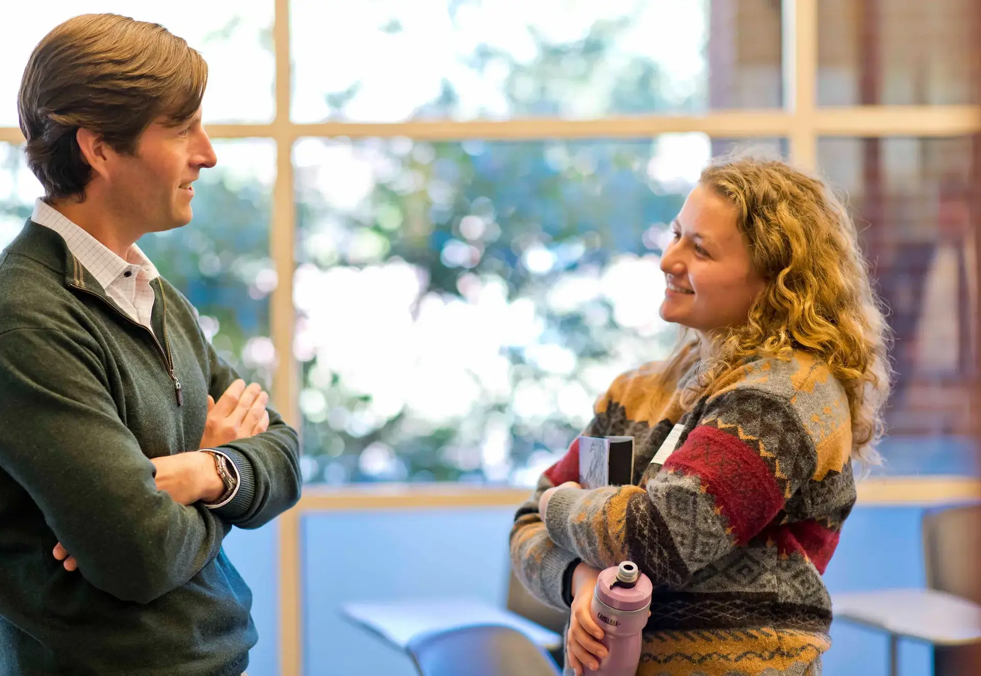 alumni and student having a conversation