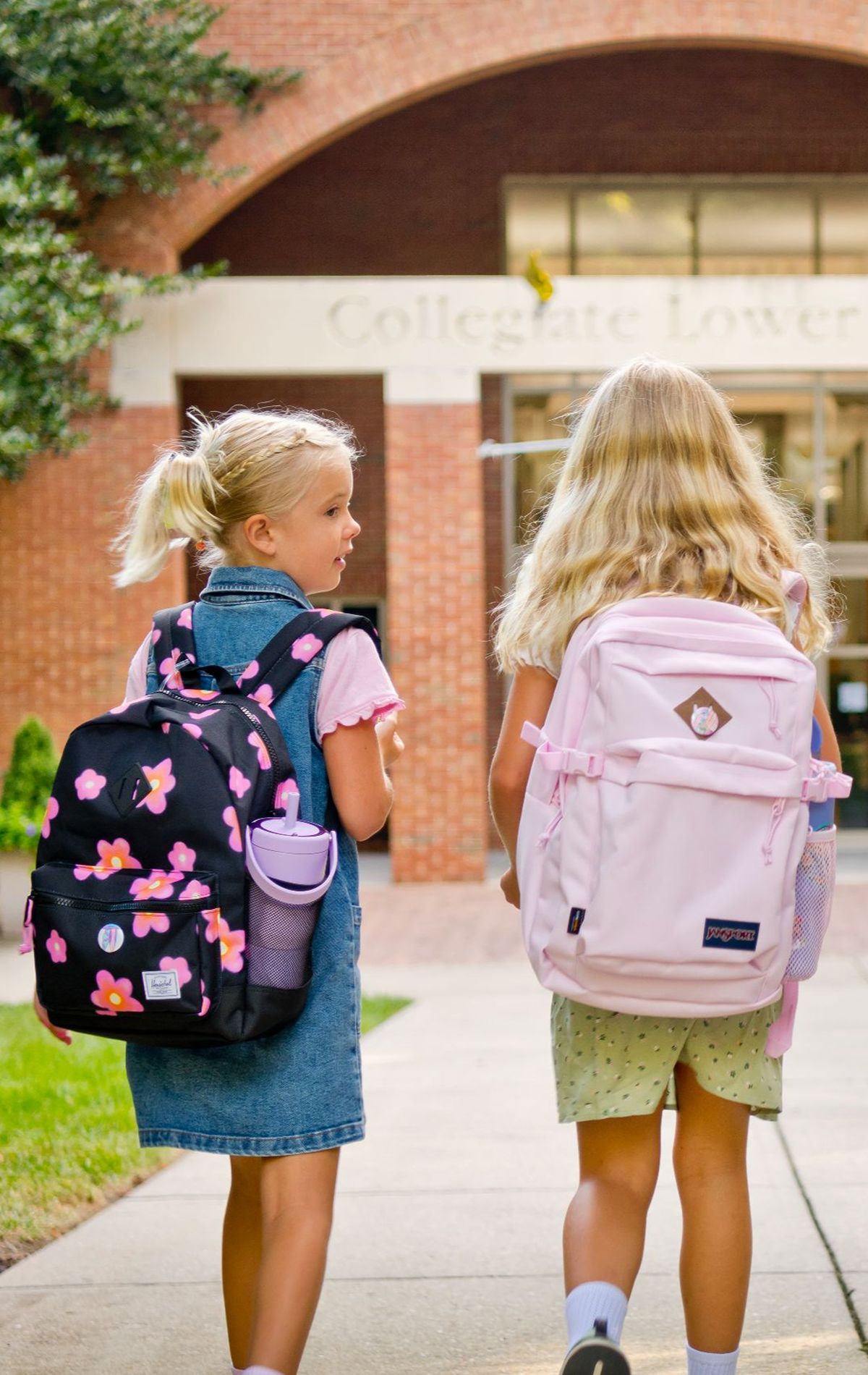 students walking together to school building