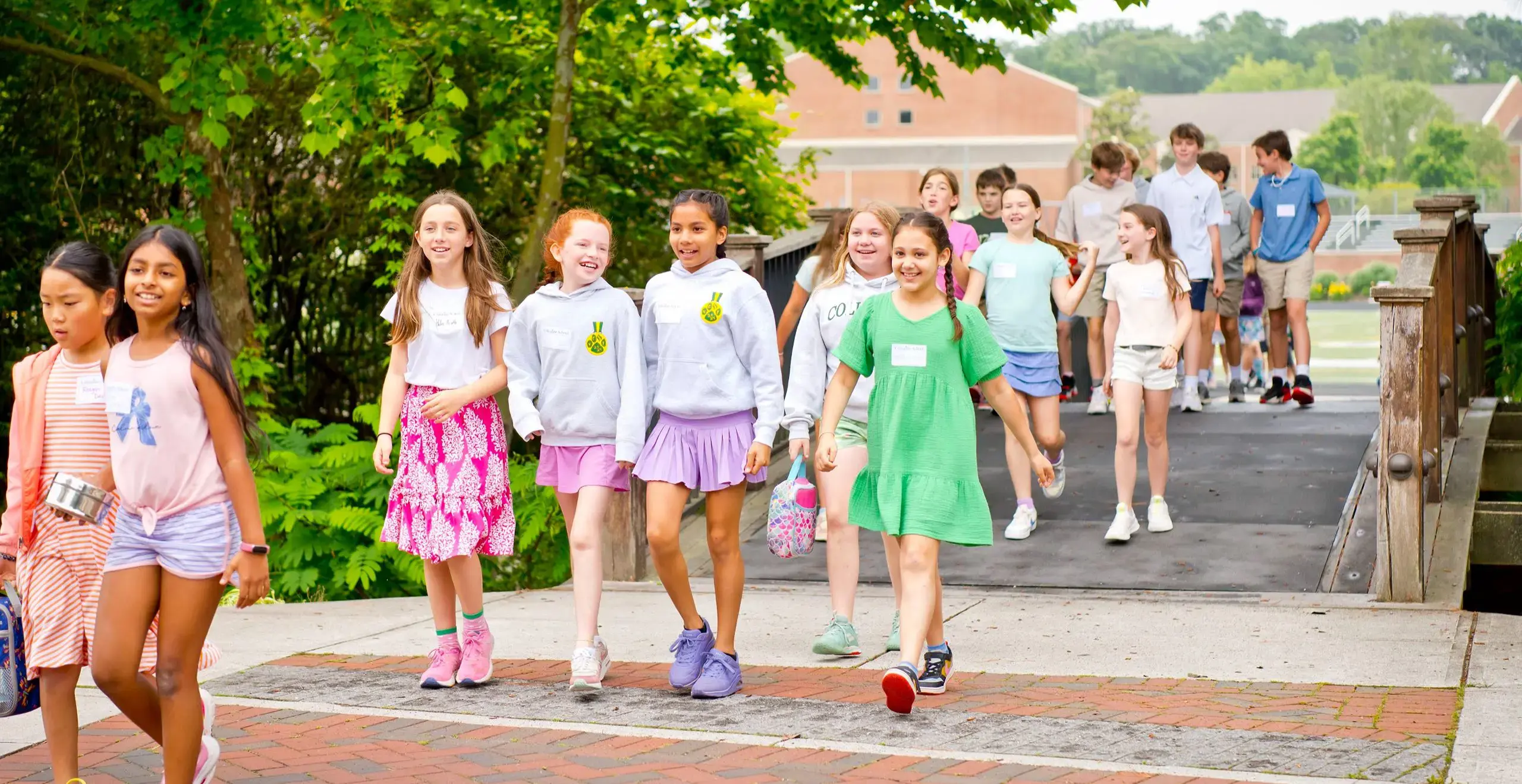 lower school students walking together in campus