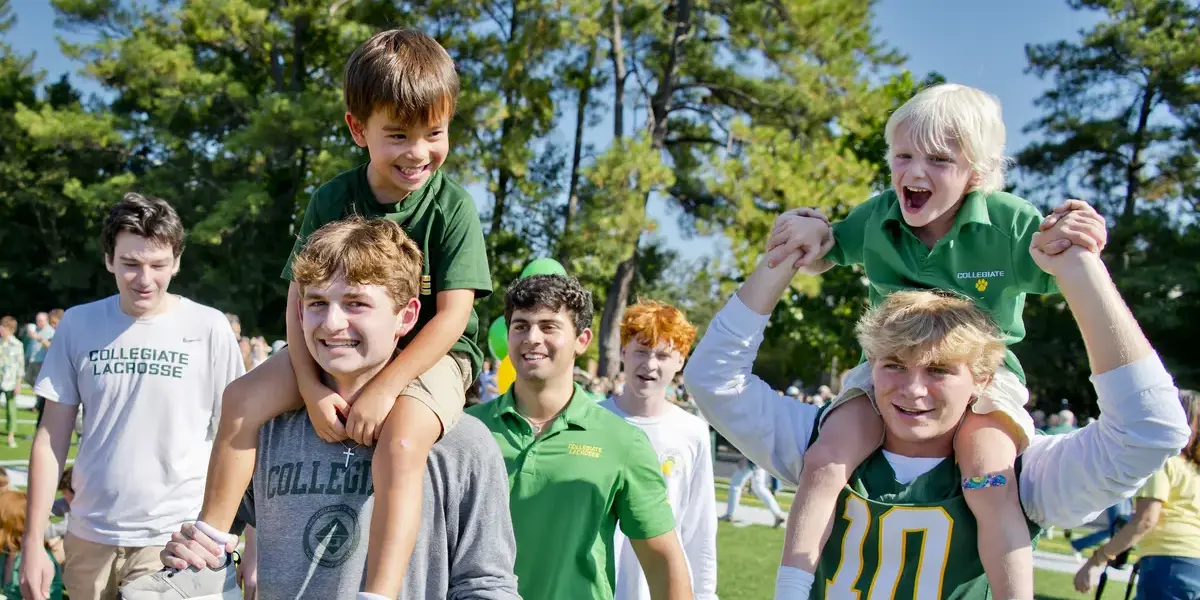 Upper school students walking with lower school students