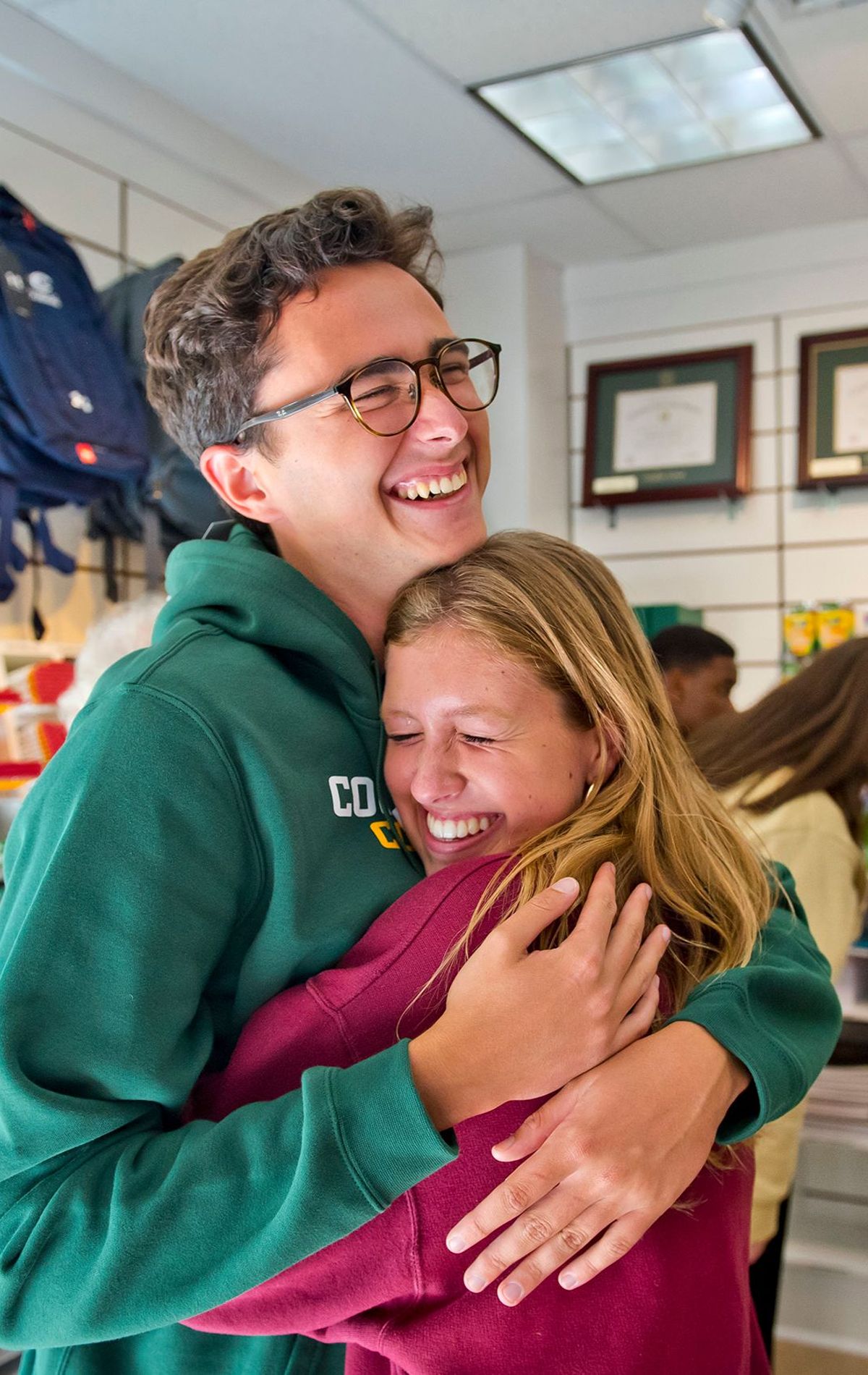 students hugging