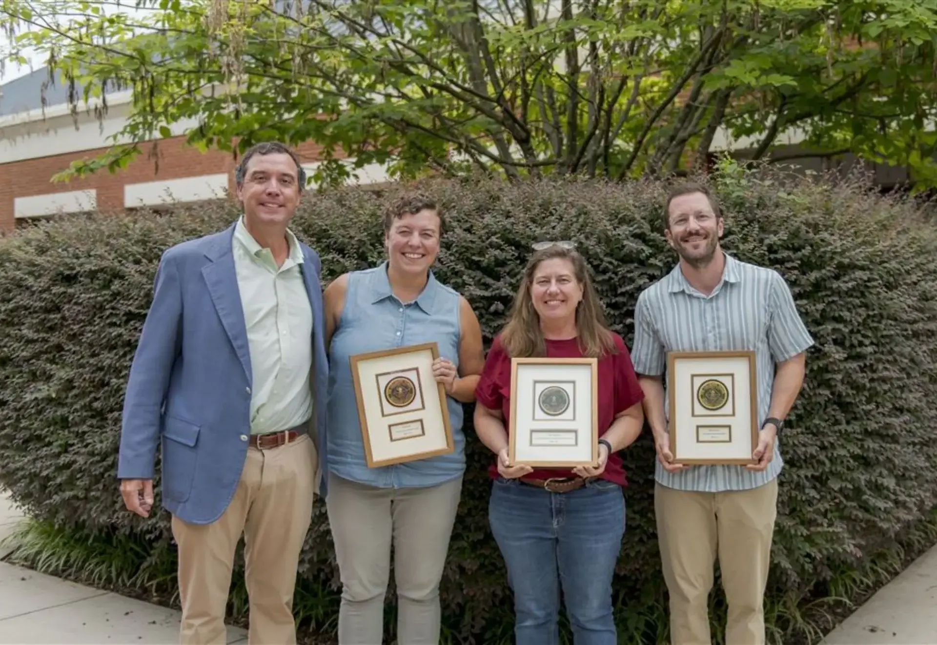 teacher showing their awards