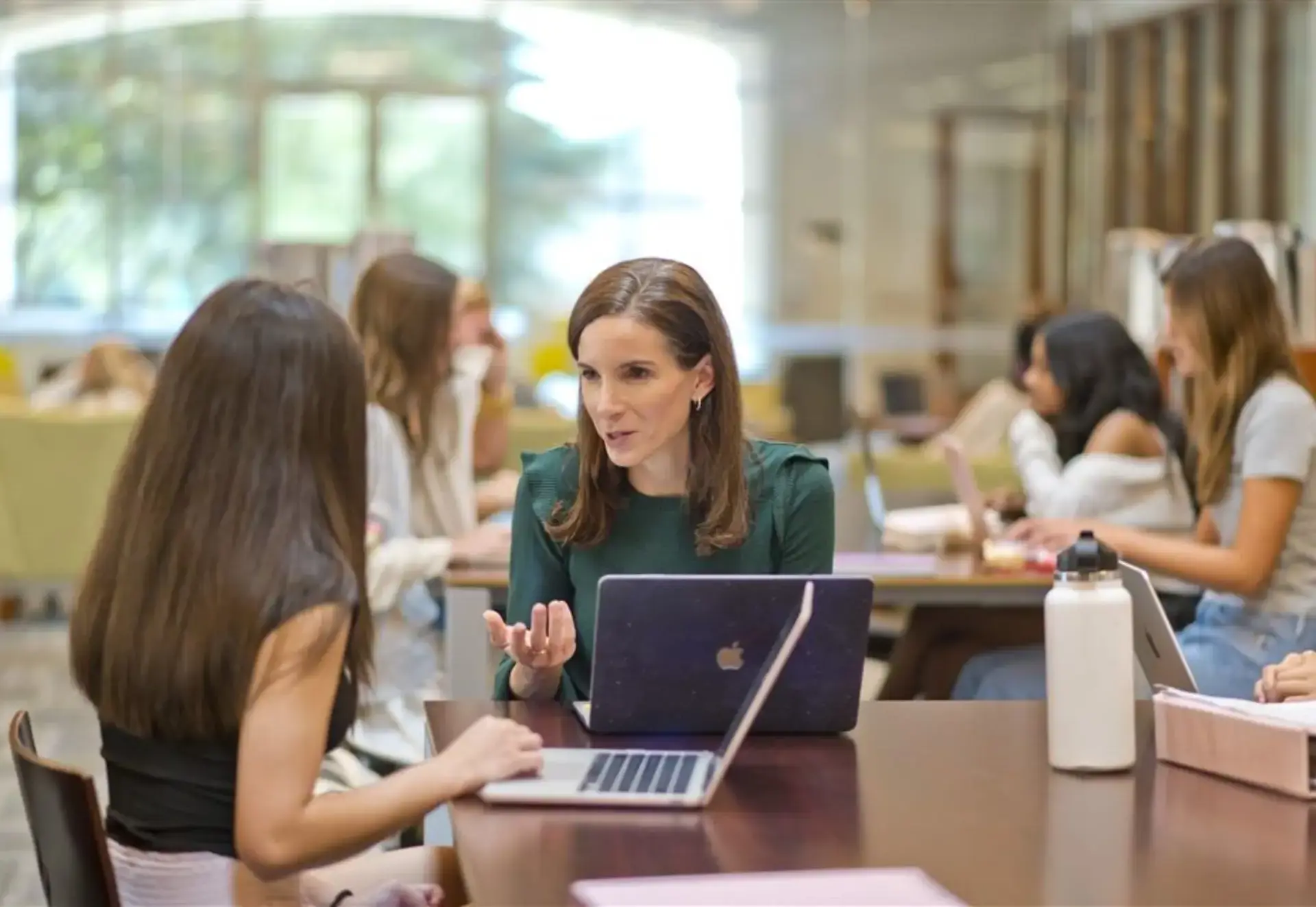 Dr Leah Angell talking to a student