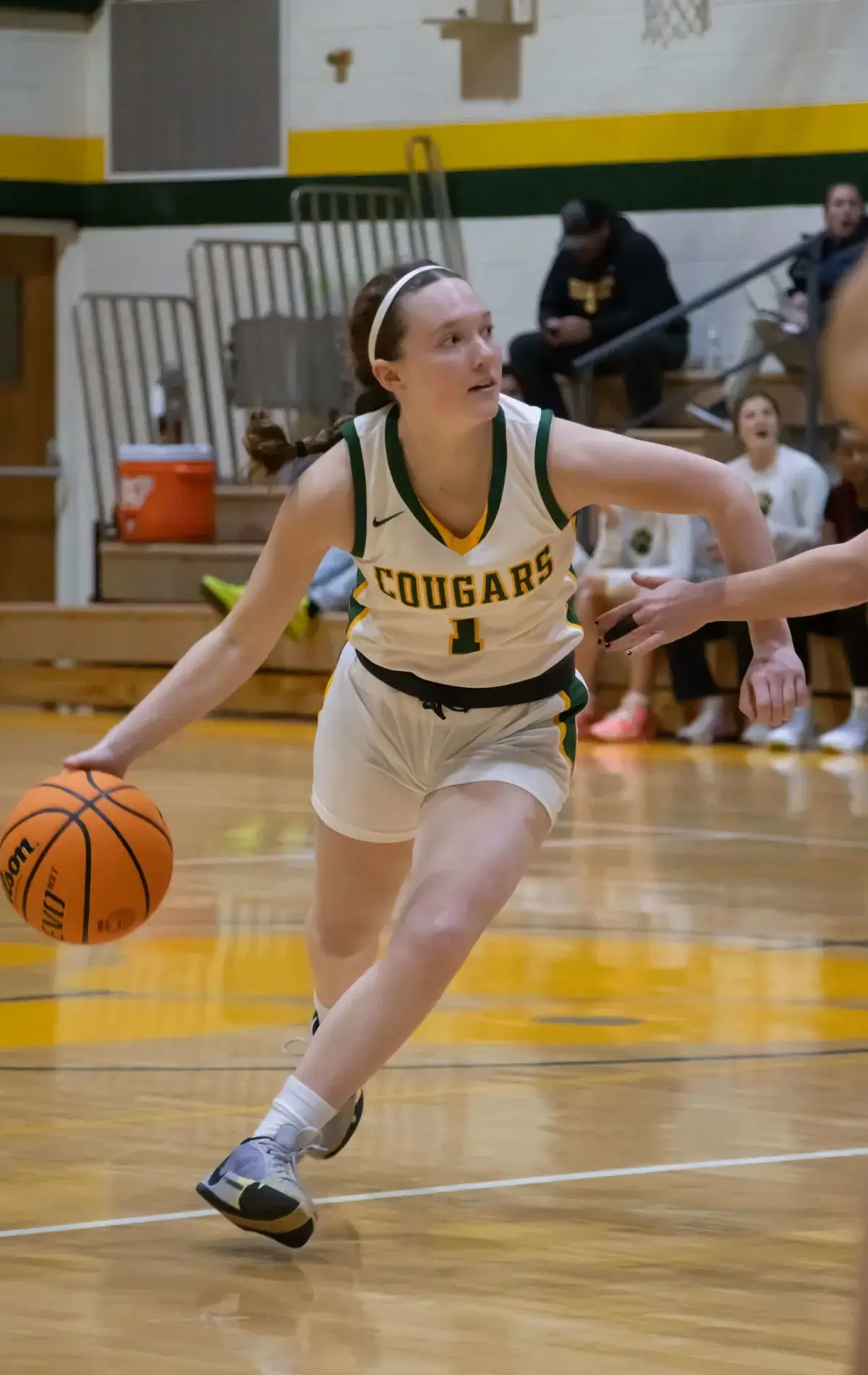 Student playing in a basketball tournament