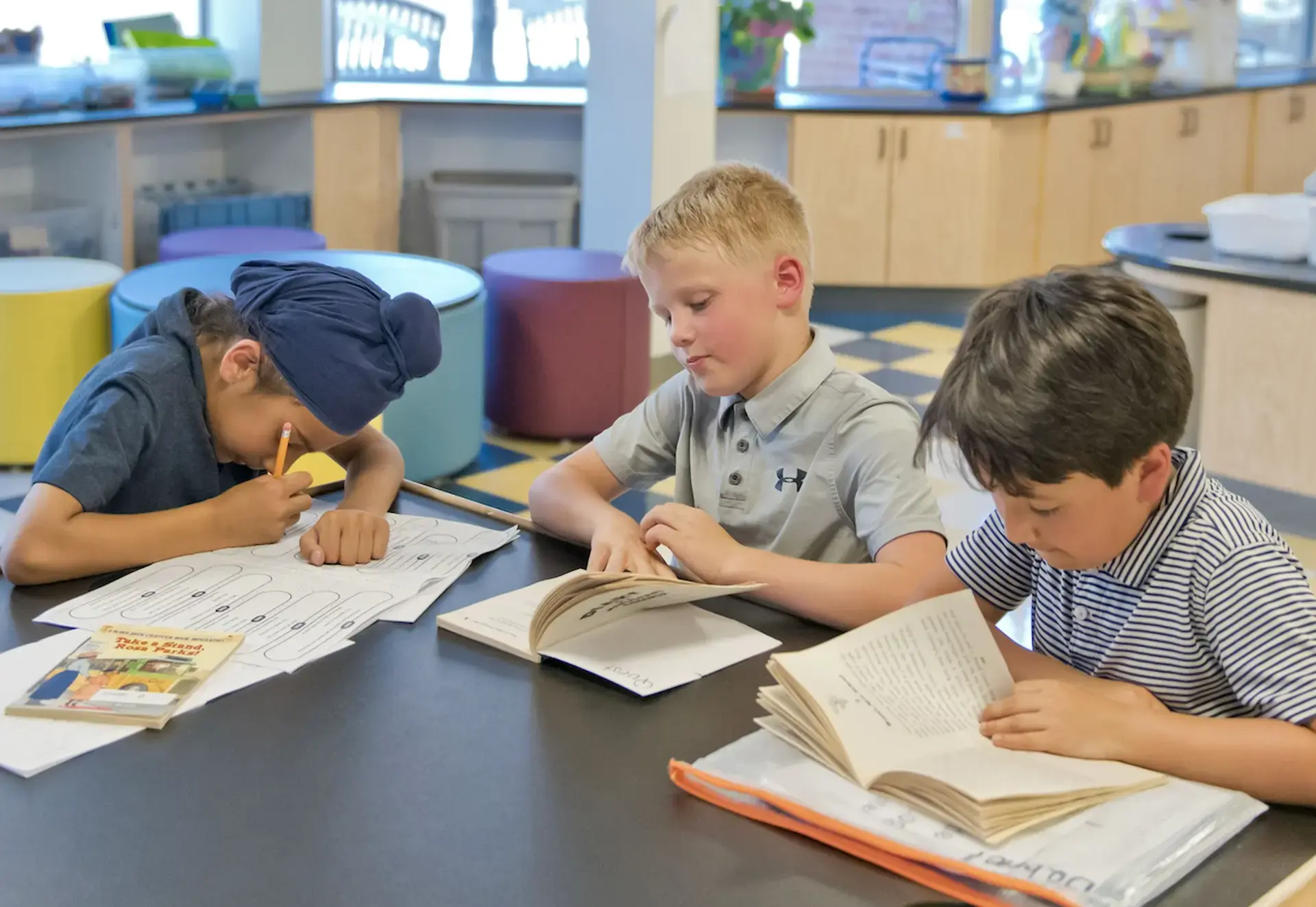 Students writing on notebooks