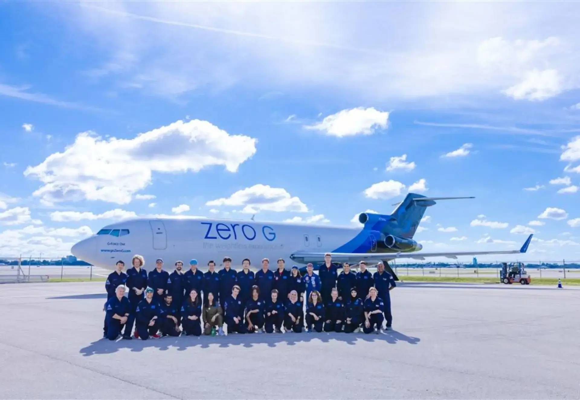 crew standing infront of a plane