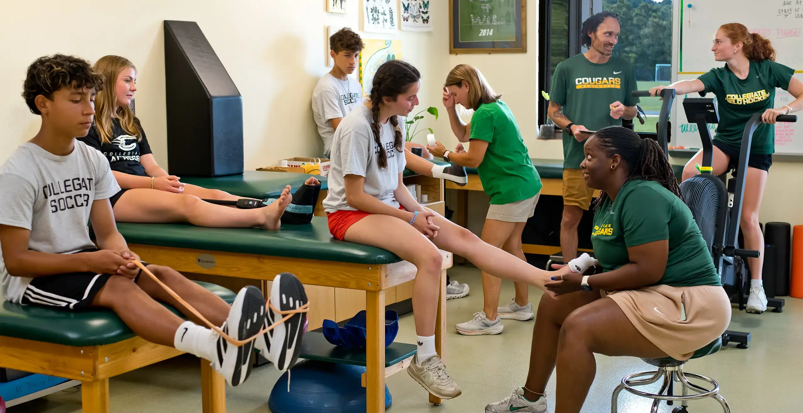 Students receiving support during a sports therapy session