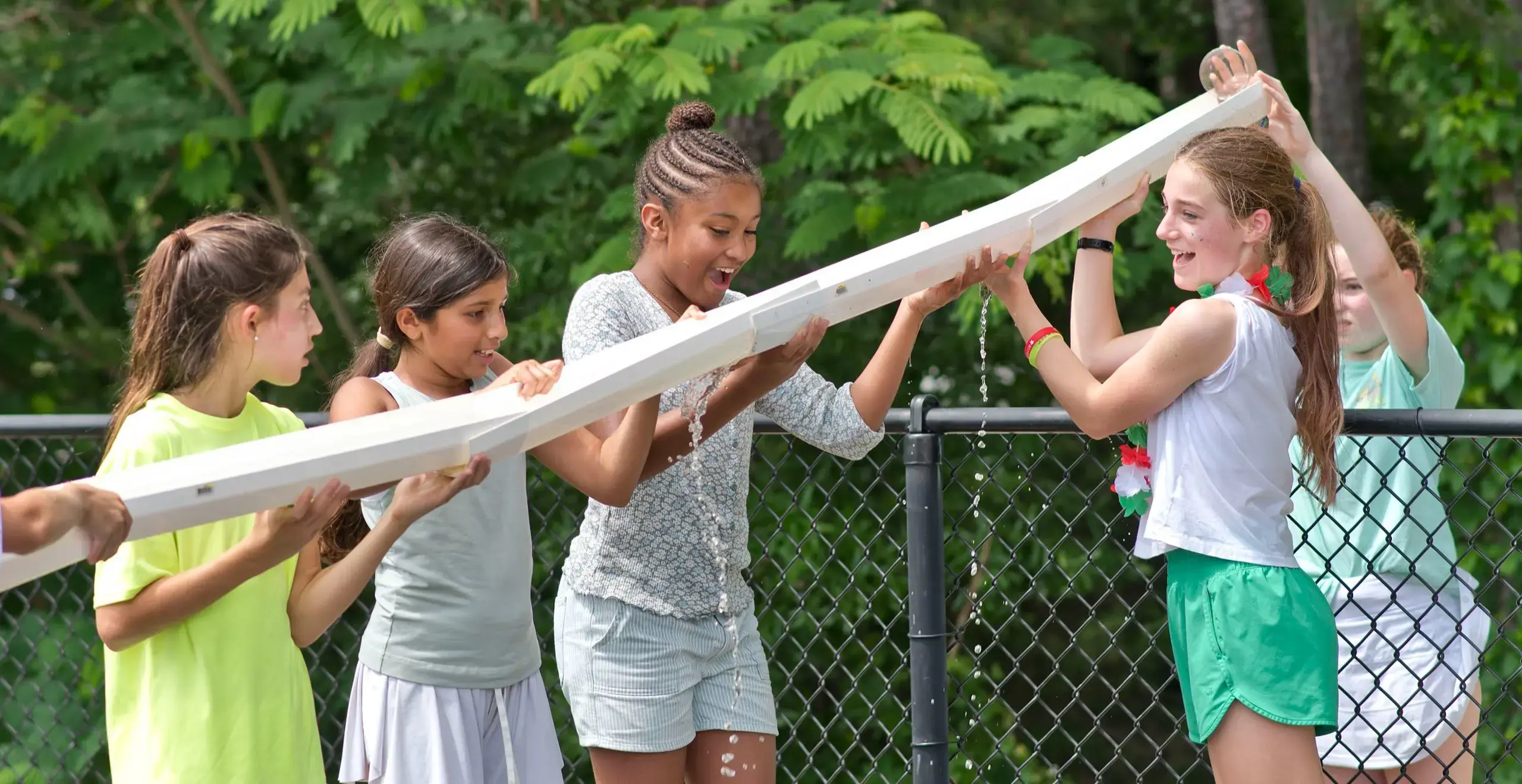 Students engaging in water play activity