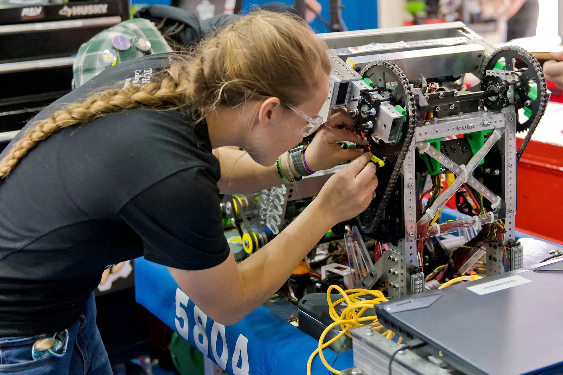 Student building a robot for a robotics competition.
