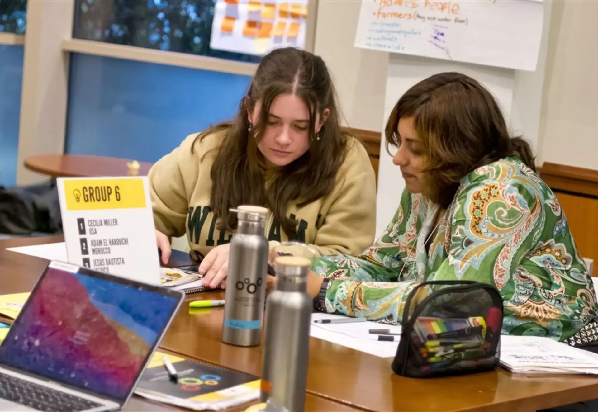 student and teacher talking
