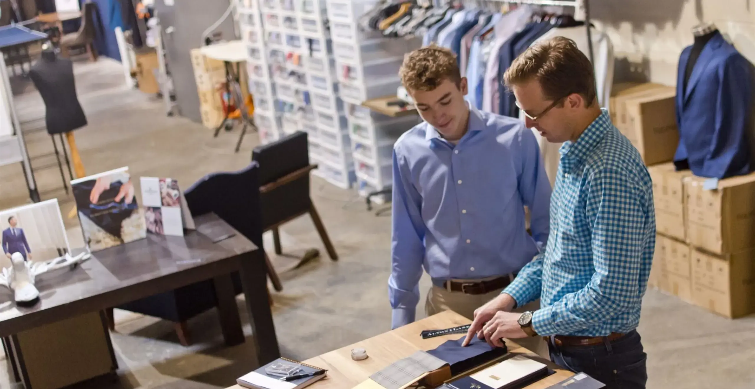 Alumni showing students different fabric types