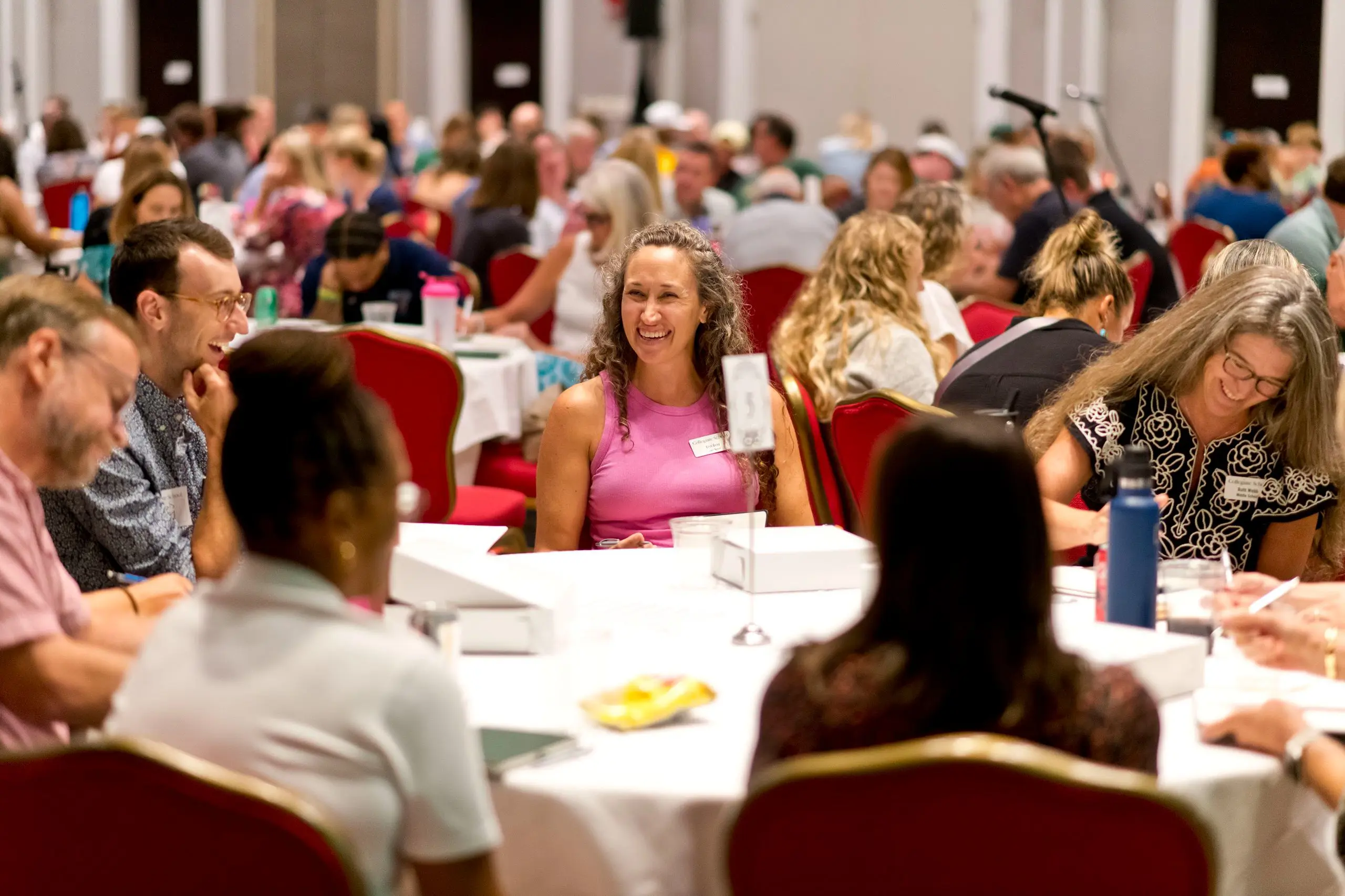 teachers sitting at a table in a conference 